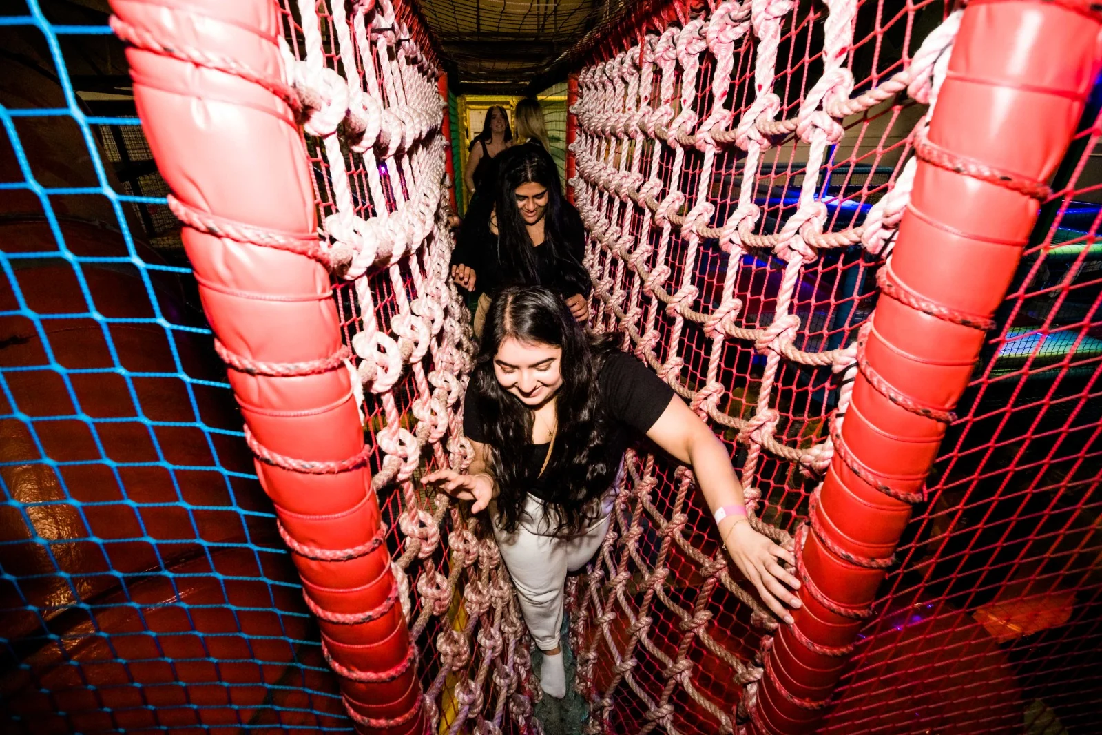Crossing the soft play rope bridge