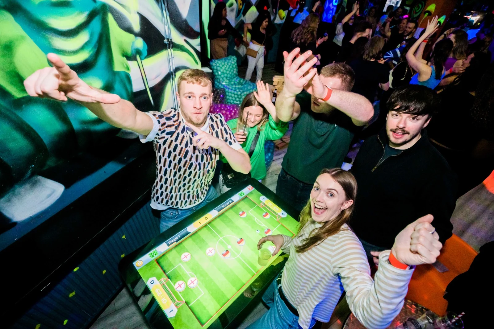 Guests playing the interactive table game
